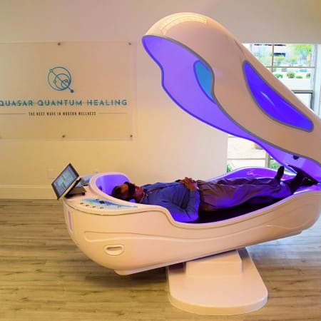 Woman wearing an rTMS machine