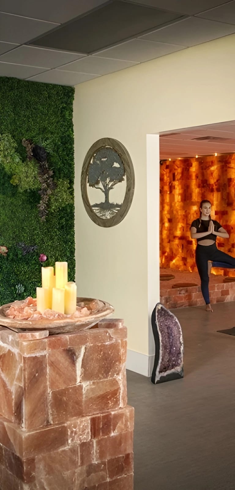 Woman doing a yoga pose in The Halo Sanctuary
