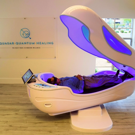 Woman wearing an rTMS machine